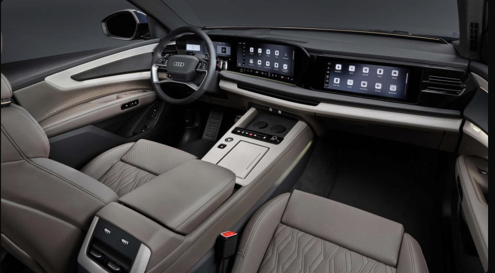 2027 Audi Q9 interior showing triple-screen setup under curved glass, icon-grid infotainment display, beige leather seats